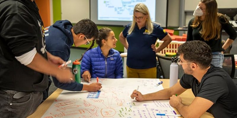Diann Brei with students